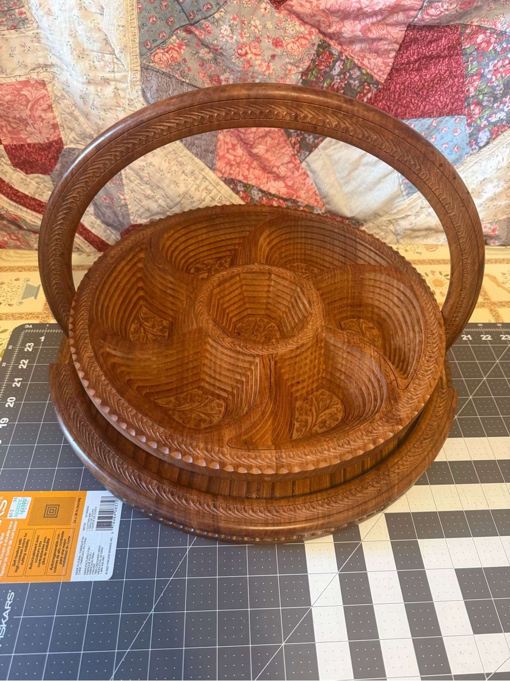 hand-carved wooden collapsible basket.